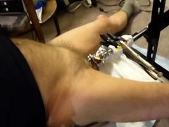 Fuck machine sounding my cock in chastity cage