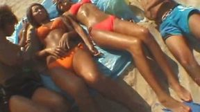 Having fun with these suntanned ladies on the beach