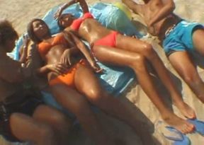 Having fun with these suntanned ladies on the beach