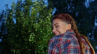 A couple has outdoor sex on a bench in the evening