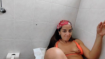 She takes me to the toilet of the beach bar to have her ass opened, then she jerks me off until I cum