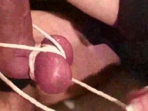 Harshly tied dick and balls gets handjob