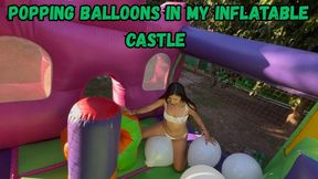 Popping balloons in my inflatable castle