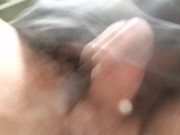 Never-ending pee. View from the bottom of a glass. Balls and uncut POV