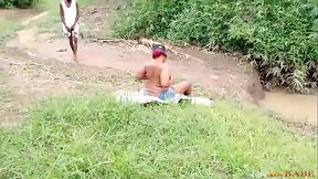 WHAT IS THIS LADY DOING AT THIS WATERSIDE INSIDE THIS FOREST