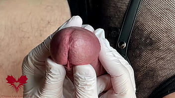 Glans game with white latex gloves in super-closeup. Alternative view.