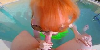 Mature redhead RedXXX gives sexy outdoor blowjob by the pool