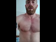Muscular man bodybuilder is showing his muscle and masturbate