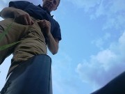 Farmer shows his dirty rubber boots and pee huge in the wheat field