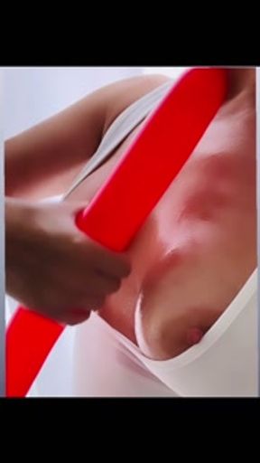 Stroking a Balloon On My Oiled Titties And Then I Squirt