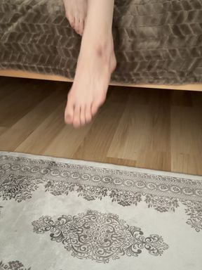 Close-up of foot on rug