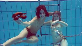 Two pale skin and sexy Russian teens in the pool get topless
