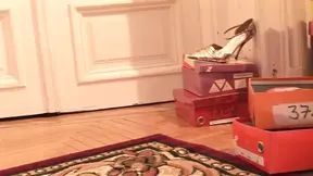 Beautiful girl tries on shoes while being pleasured by her lesbian clerk