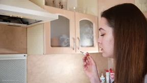 Ksenia smoking in the kitchen