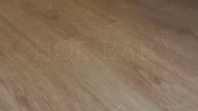 Wife give shoejob with brown heels to husband after work