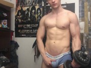 Chris Wild doing biceps curls and masturbates his big cock