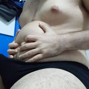 Chubby guy cumming sitting on bed