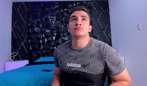 latino strokes his big uncut cock on cam