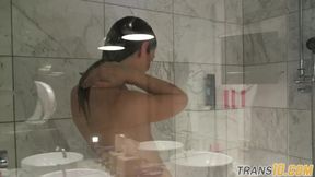 Smalltitted tranny showering while filmed