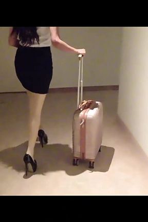 MILF in Stockings and Heels Walks Through the Corridors of a Hotel