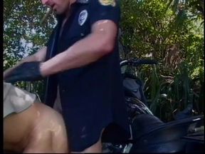 Two dude cops drop their pants and suck each other off