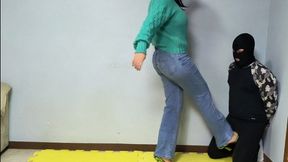 738 Wearing her casual clothes and green high heels, Sylvana demonstrates her strength by kicking Slade's balls.