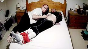 Miss M keeps a man tied up on bed in tight leggings