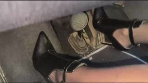 Marie driving highspeed in Ankle Boots in town