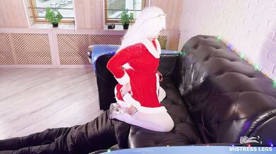Christmas Mistress in white stockings sits and bounces her ass on the slave's face near the sofa-mob