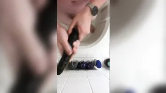 Solo stud rides big dildo in shower until cumshot