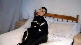 Adorable cunt with mouth into Ebony Rubber Catsuit with Mask makes self Bdsm inside