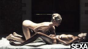 ”Ebony hot chick & sexy blonde oil each other up for lesbian sex”