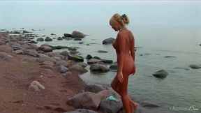 cute blonde masha is rubbing her softly body on the beach!