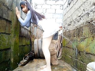 Peeing from behind onto the wall after watching parade