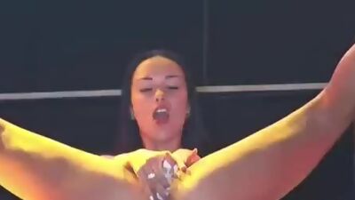 Doll fucks with dildo on stage