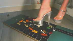 Giantess goddess WinnieLouxo Crushes many tiny plastic cars and a bus in big stripper heels with painted toenails left low view