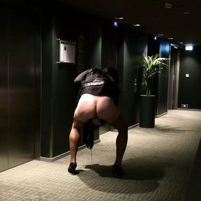 Crossdresser having Dildo fun in front of hotel elevators