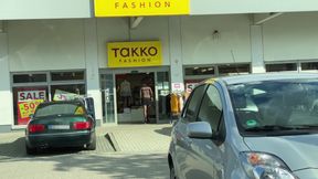 In a super short mini skirt and a thoughtful bodysuit while shopping