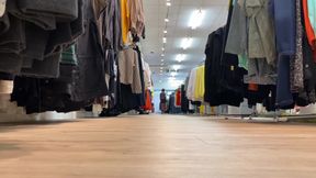 In a super short mini skirt and a thoughtful bodysuit while shopping
