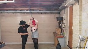Bondage in a garage for a slave girl topped by Redstripe