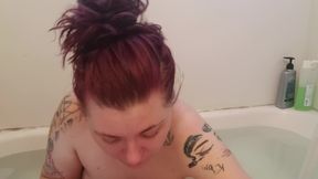 Naked milf smoking a cigarette while applying makeup in the bath