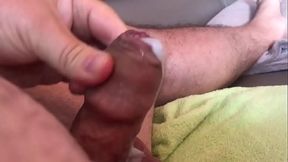 Uncut cumshot close up