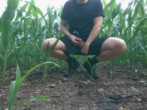 Guy Pissing a Lot Near the Field in Nature
