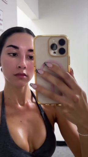 Izzy shows off her thick ass while teasing with her tits exposed, all in a playf