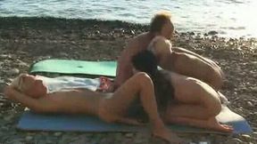 Sex-starved bimbos are having an orgy on the beach