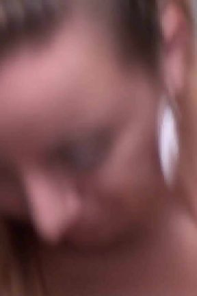 Brunette crushing food in the kitchen