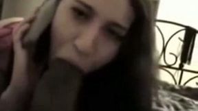 Skanky girl sucking big black dick while talking to her BF on a phone