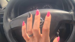 nails tapping on steer wheel
