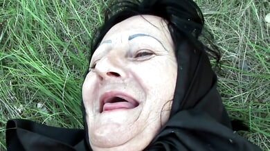 Mature brunette takes her lover outdoors for wild grassy sex