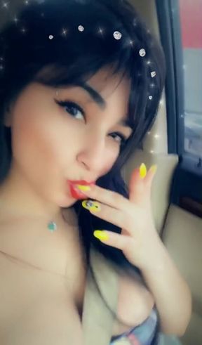 A horny girl in the car speaking Spanish